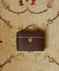 Brown handbag with gold accents